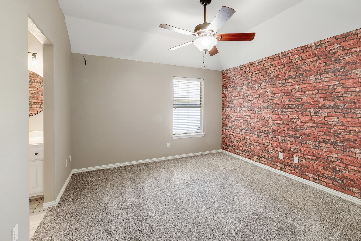 1900 Alamo Bound Leander, TX 78641 - Photo 32 of 38 an empty room with a chandelier fan and windows