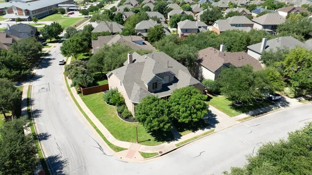 an aerial view of residential house with outdoor space and street view