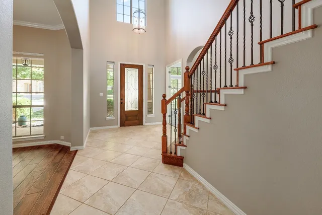 a view of entryway with stairs and wooden floor
