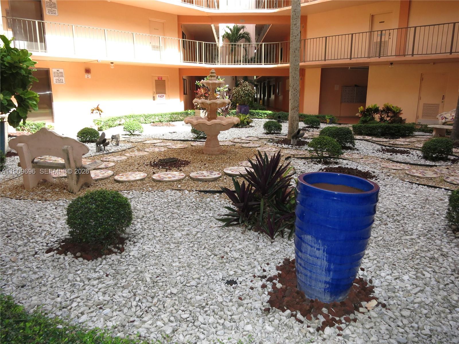 a view of a backyard with sitting area