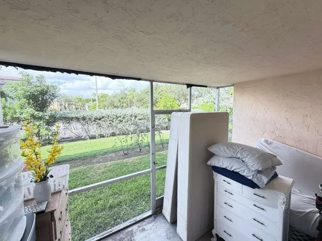 a view of walk in closet with clothes