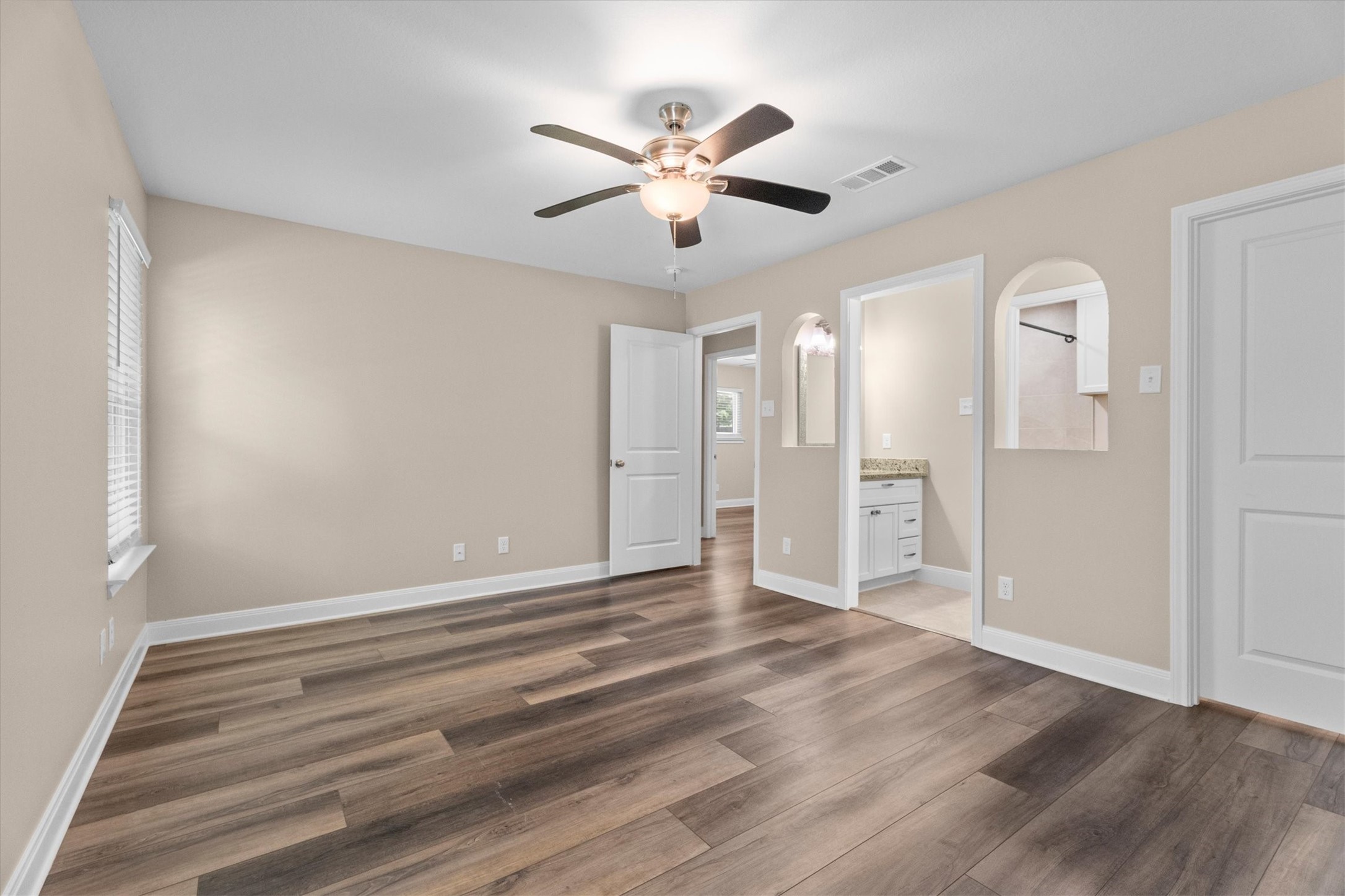 6530 Bayonne Drive Spring, TX 77389 - Photo 28 of 37 a view of an empty room with wooden floor and a ceiling fan