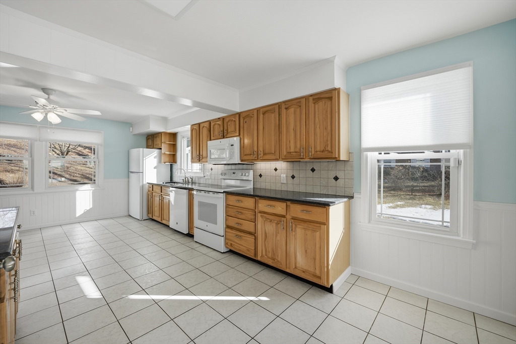 88 Verdugo Street West Springfield, MA 01089 - Photo 12 of 42 a kitchen with stainless steel appliances granite countertop a stove a sink and a refrigerator