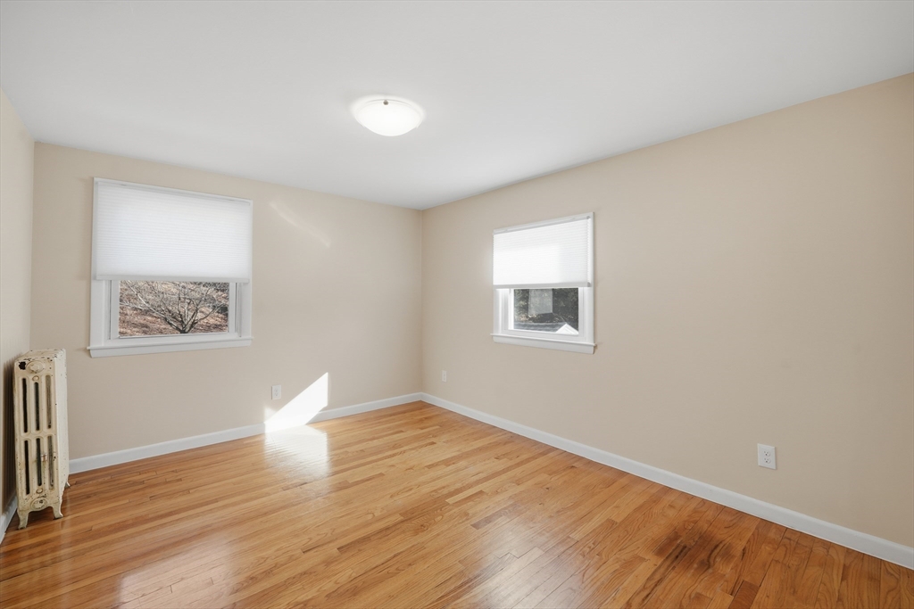 88 Verdugo Street West Springfield, MA 01089 - Photo 22 of 42 a view of a room with wooden floor and window