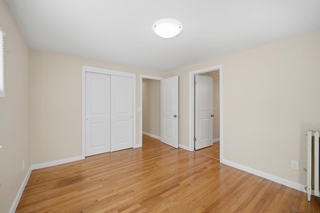88 Verdugo Street West Springfield, MA 01089 - Photo 24 of 42 a view of an empty room with wooden floor