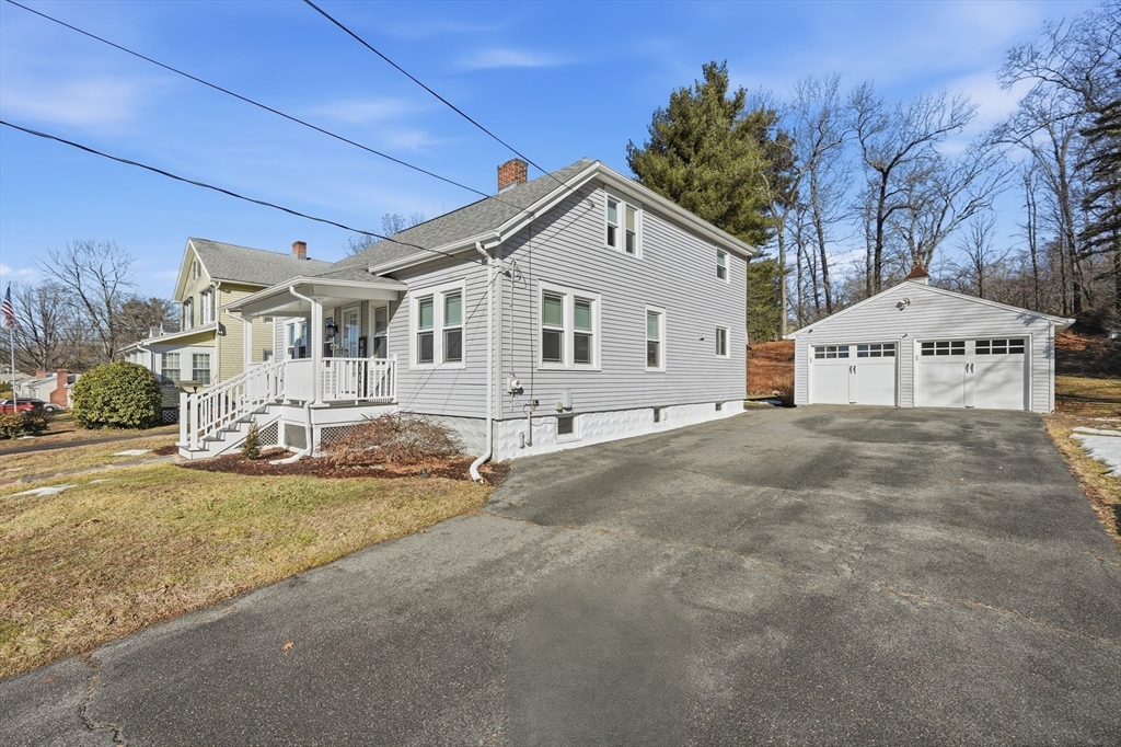 88 Verdugo Street West Springfield, MA 01089 - Photo 39 of 42 a view of a white house with a yard and large tree