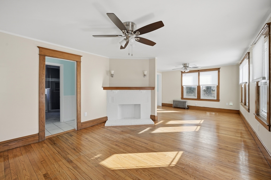 88 Verdugo Street West Springfield, MA 01089 - Photo 5 of 42 a view of a livingroom with wooden floor and a ceiling fan