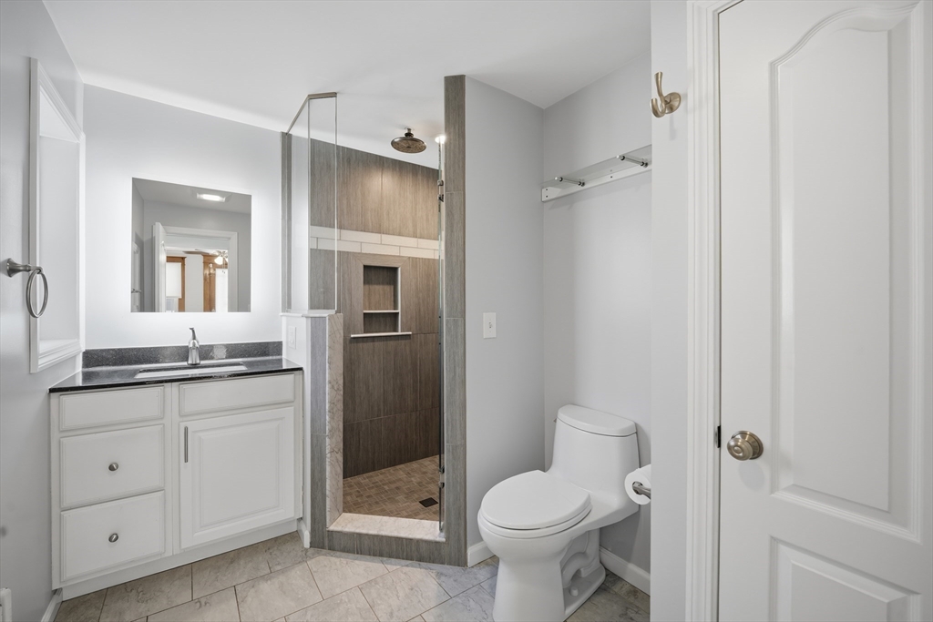 88 Verdugo Street West Springfield, MA 01089 - Photo 8 of 42 a bathroom with a granite countertop sink toilet and shower