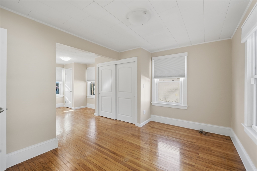 88 Verdugo Street West Springfield, MA 01089 - Photo 10 of 42 a view of an empty room with wooden floor and a window