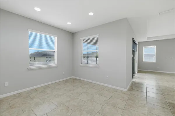 a kitchen with stainless steel appliances granite countertop a stove top oven a sink a counter top space and cabinets