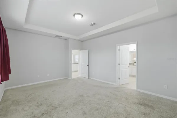 a bathroom with double sink and a shower