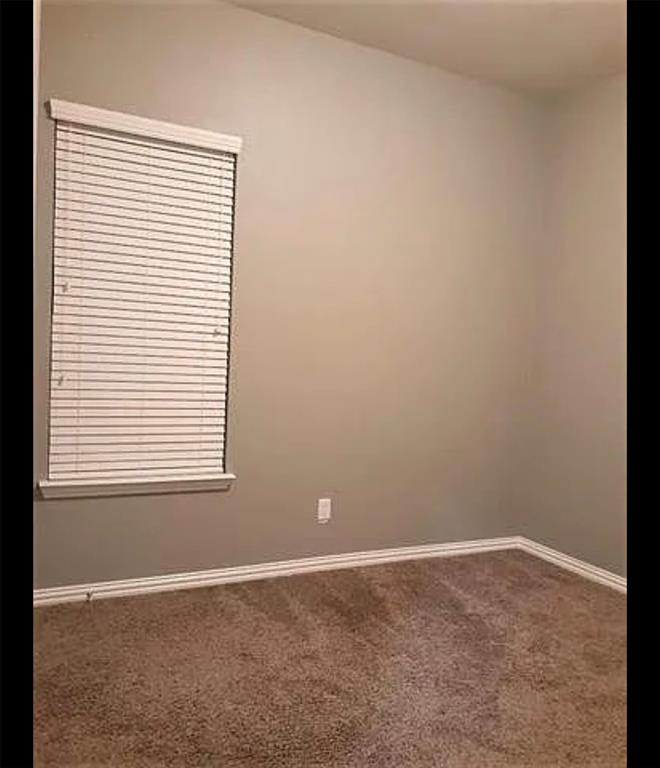 3905 Gennaker Drive Denton, TX 76210 - Photo 9 of 13 a view of an empty room with a window