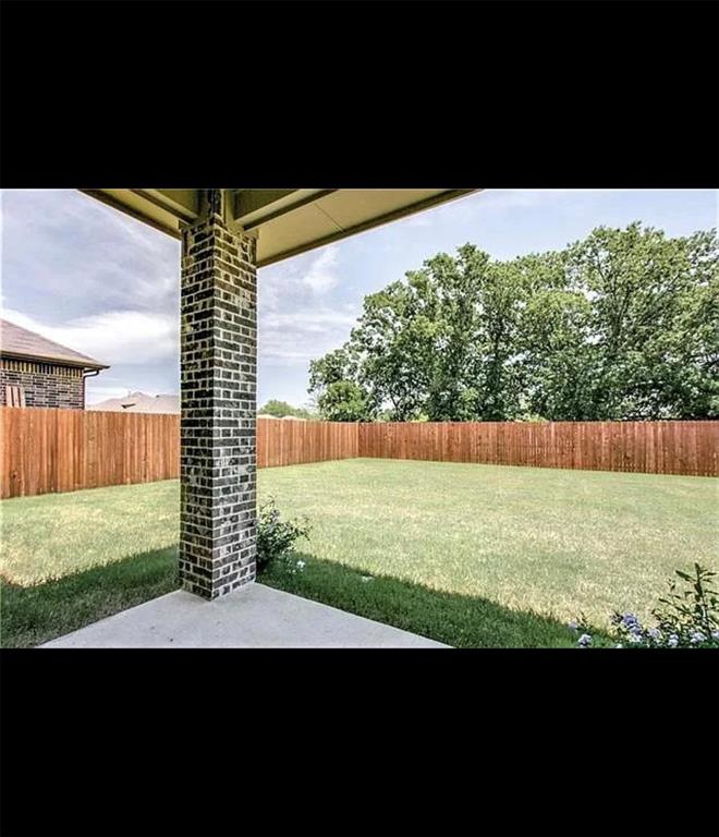 3905 Gennaker Drive Denton, TX 76210 - Photo 10 of 13 a view of an outdoor space and a yard