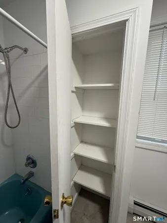 a view of a room with racks on the wall