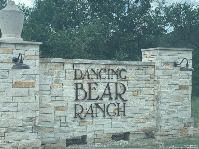 a view of a room with gym equipment and a large tree