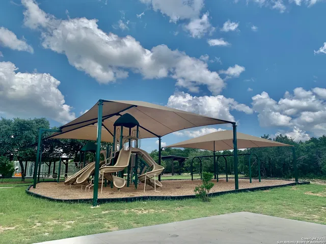 a view of a house with backyard and porch