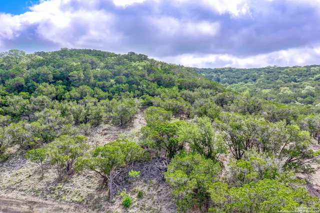 a view of a lake with houses in the back