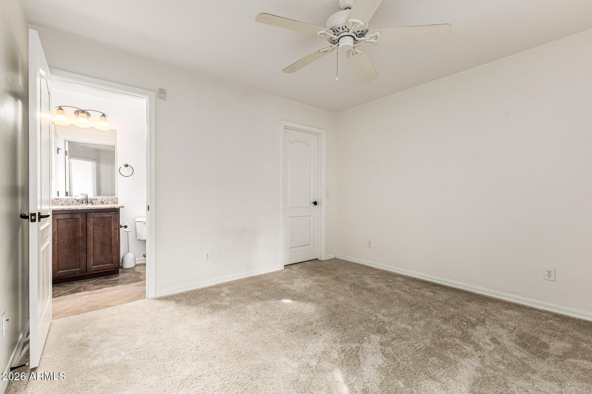 6940 East Cochise Road, Unit 1043 Paradise Valley, AZ 85253 - Photo 20 of 35 an empty room with a bathroom and a sink
