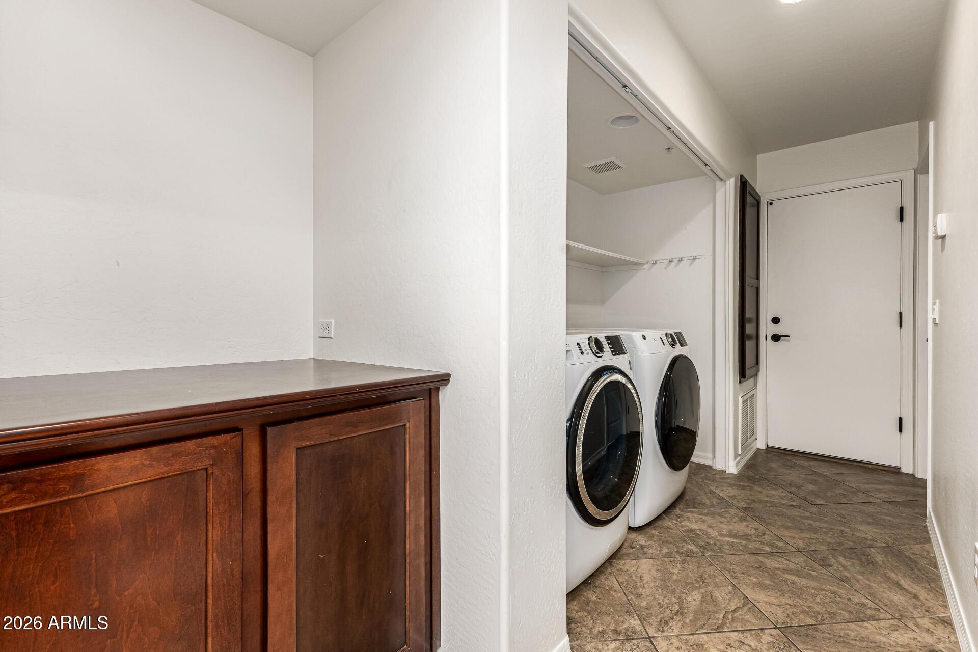 6940 East Cochise Road, Unit 1043 Paradise Valley, AZ 85253 - Photo 26 of 35 a utility room with dryer and washer