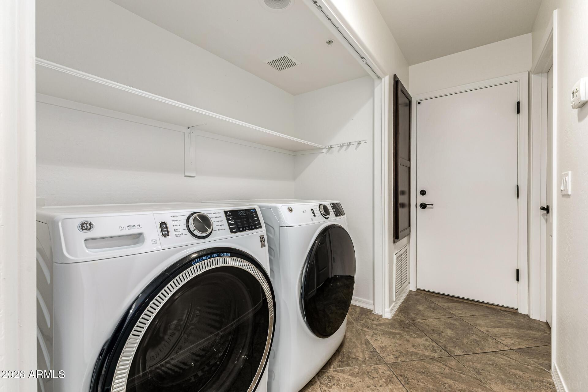 6940 East Cochise Road, Unit 1043 Paradise Valley, AZ 85253 - Photo 27 of 35 a view of entryway with washer and dryer