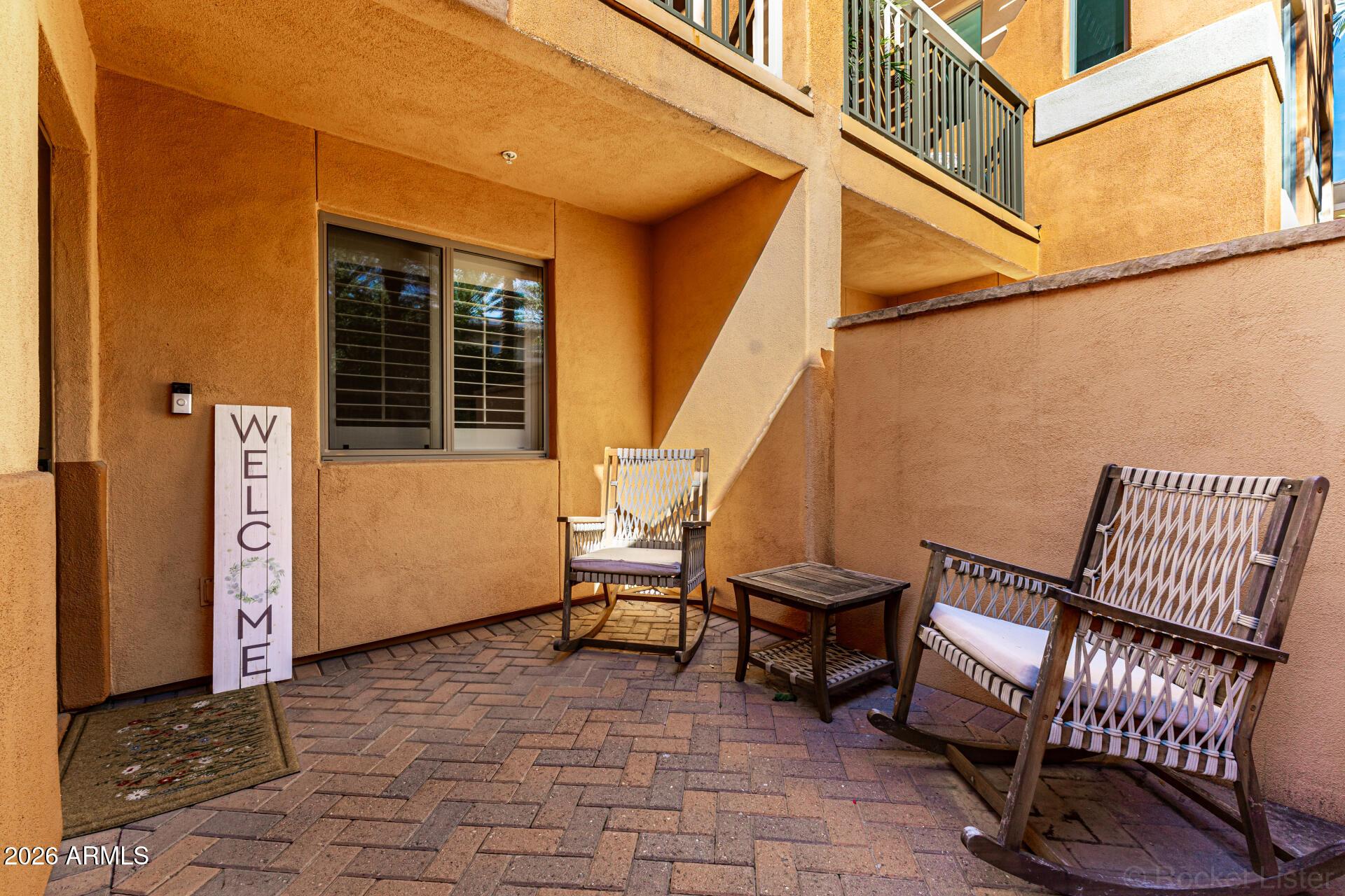 6940 East Cochise Road, Unit 1043 Paradise Valley, AZ 85253 - Photo 31 of 35 a view of a patio with table and chairs