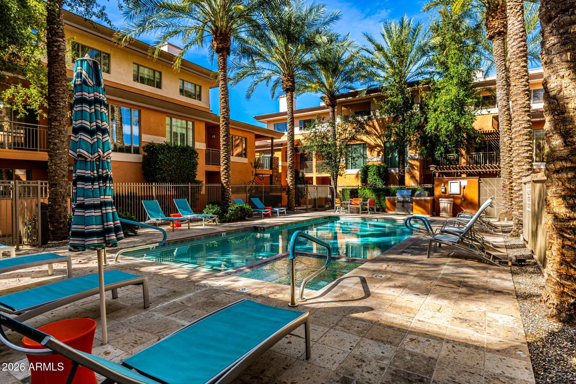 6940 East Cochise Road, Unit 1043 Paradise Valley, AZ 85253 - Photo 35 of 35 a view of a patio with swimming pool