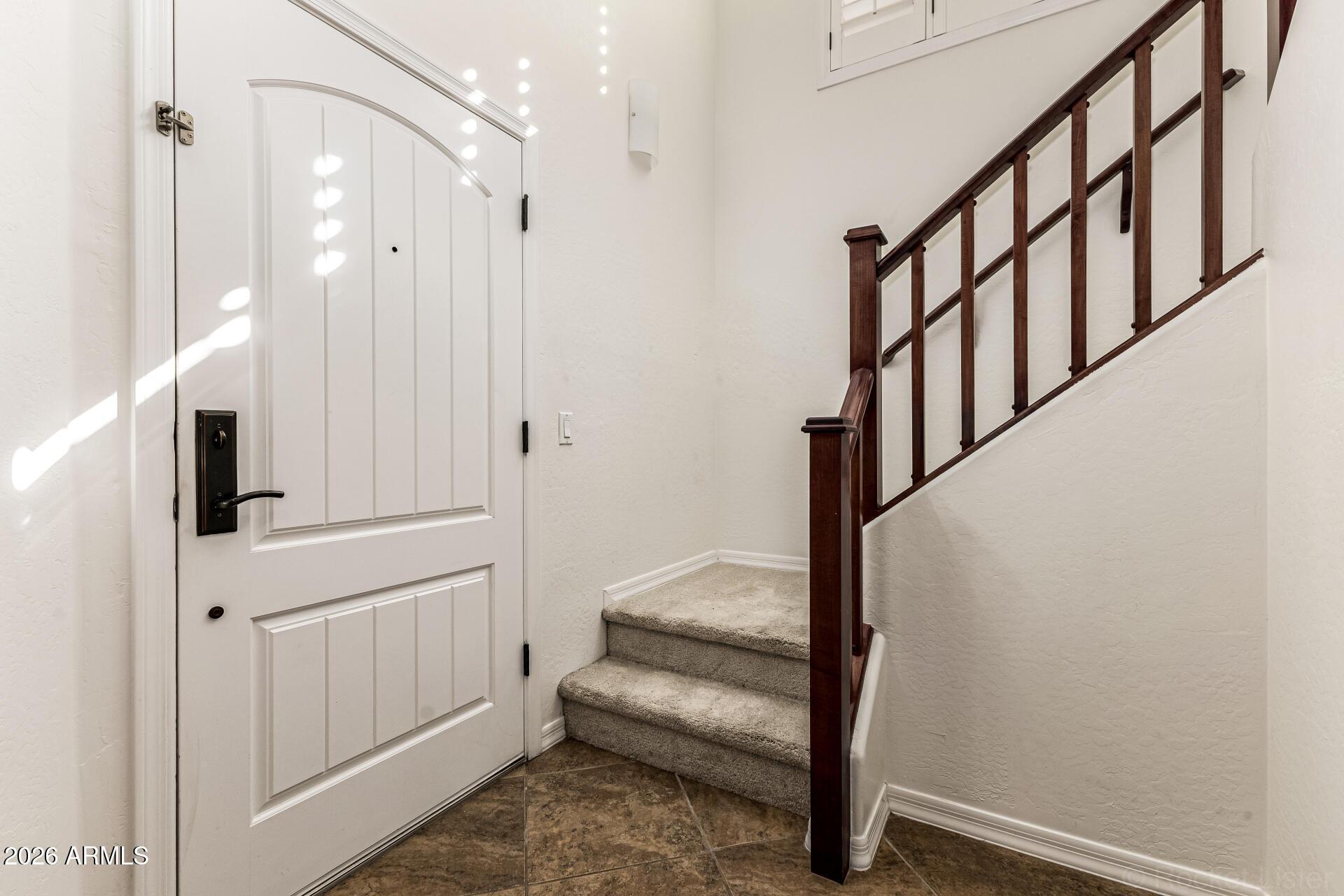 6940 East Cochise Road, Unit 1043 Paradise Valley, AZ 85253 - Photo 5 of 35 a view of entryway with stairs and wooden floor