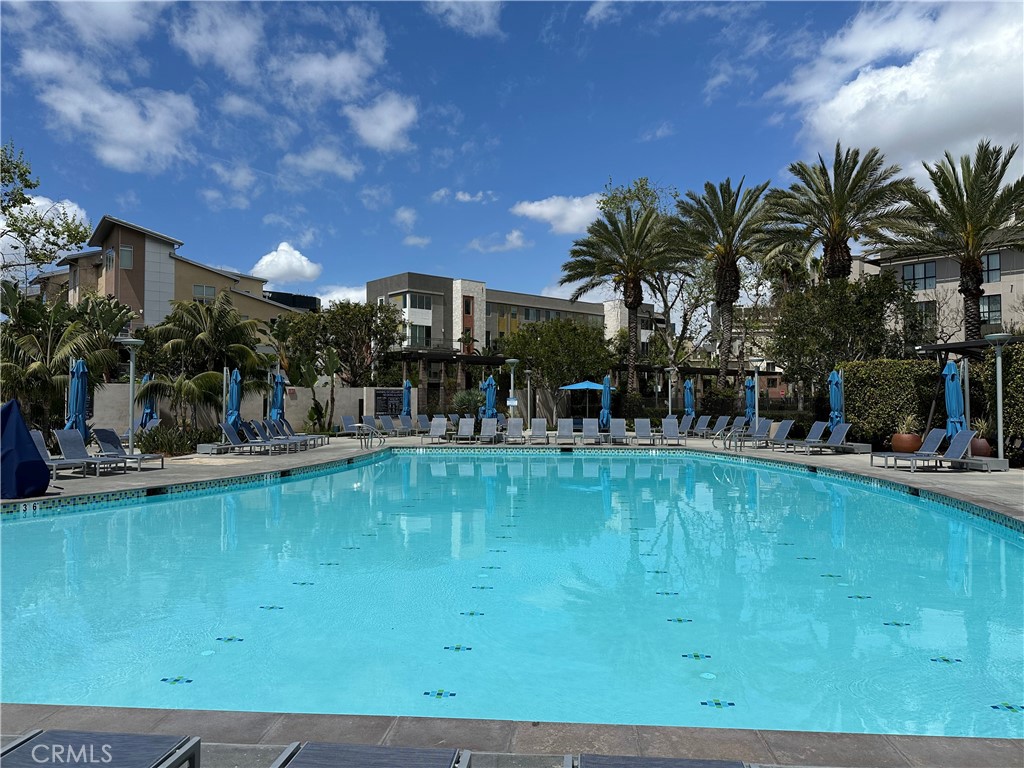 61 Gramercy Irvine, CA 92612 - Photo 26 of 33 a swimming pool with outdoor seating and yard