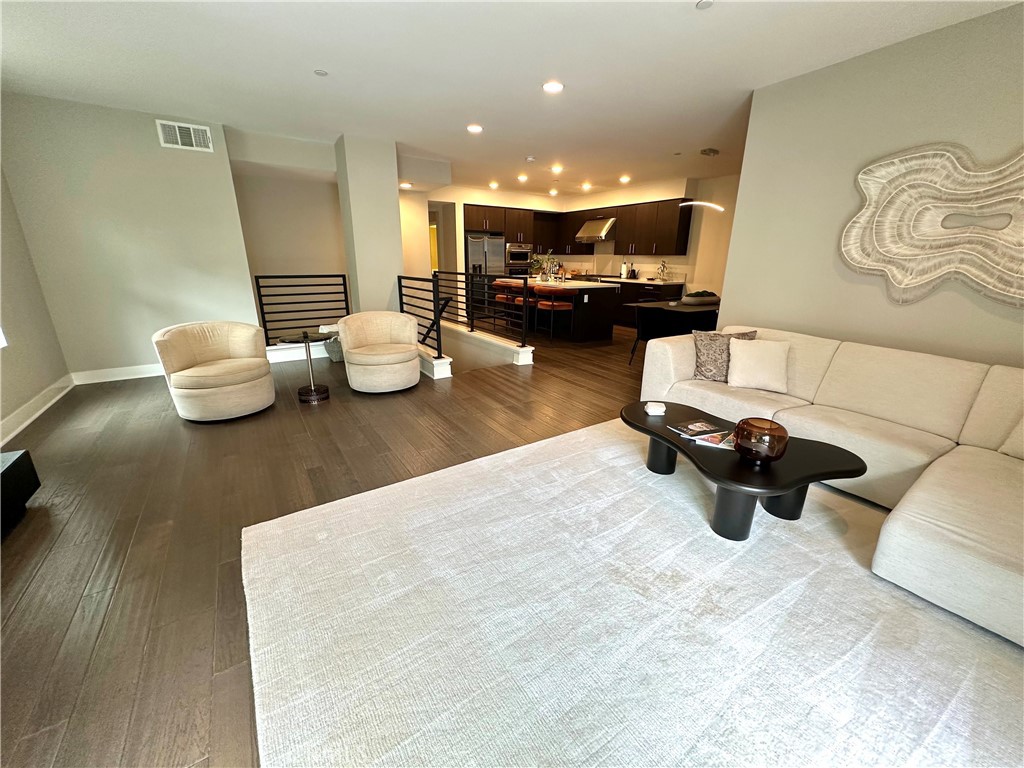 61 Gramercy Irvine, CA 92612 - Photo 3 of 33 a living room with furniture and view of kitchen