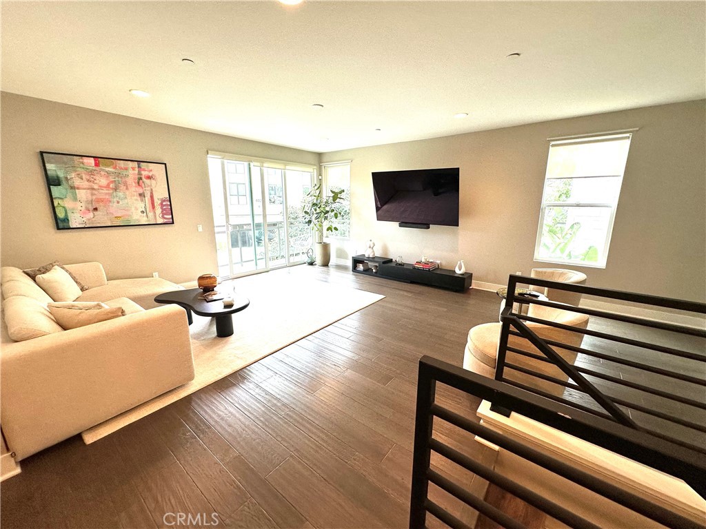 61 Gramercy Irvine, CA 92612 - Photo 6 of 33 a living room with furniture and a flat screen tv