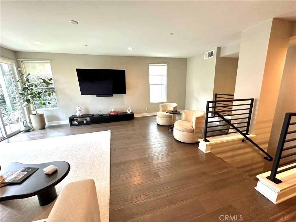 61 Gramercy Irvine, CA 92612 - Photo 7 of 33 a living room with furniture and a flat screen tv