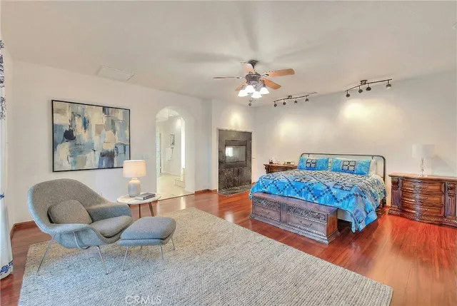 a spacious bathroom with a granite countertop shower a sink and a mirror