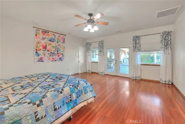 a large kitchen with a sink and cabinets