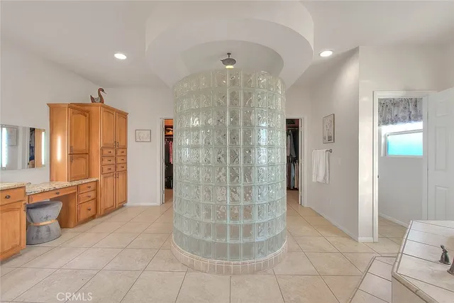 a bathroom with a tub sink and mirror