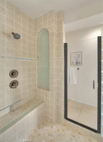 a room with furniture and a potted plant