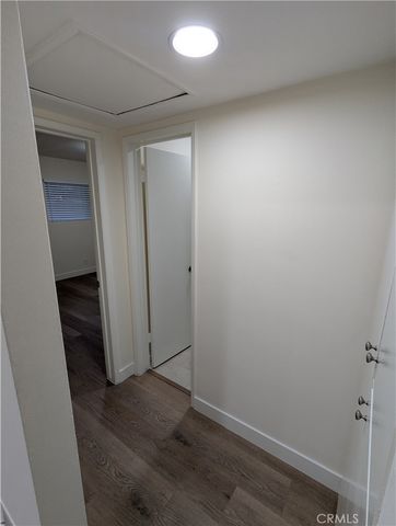 an empty room with wooden floor