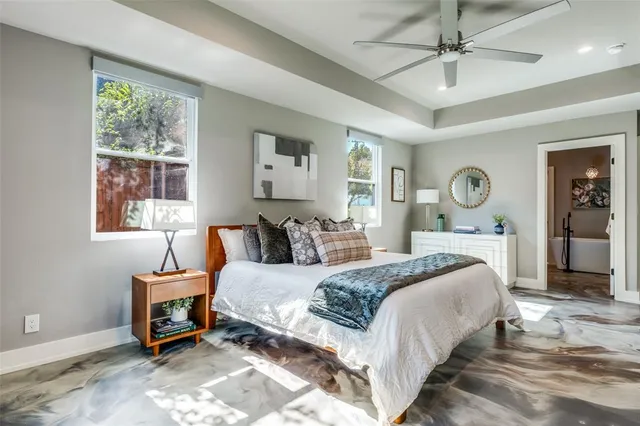 a bedroom with bed and window