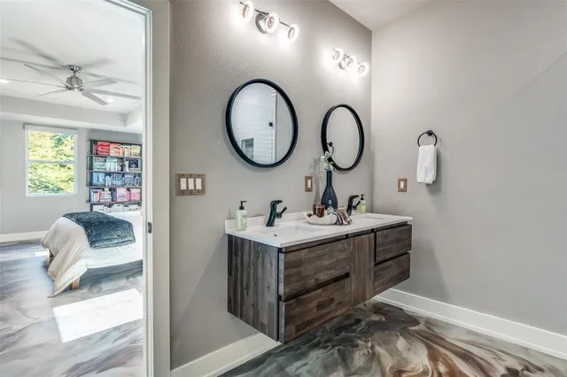 a room with a sink and a mirror