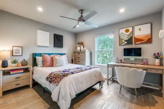 a bed room with a bed and a large window