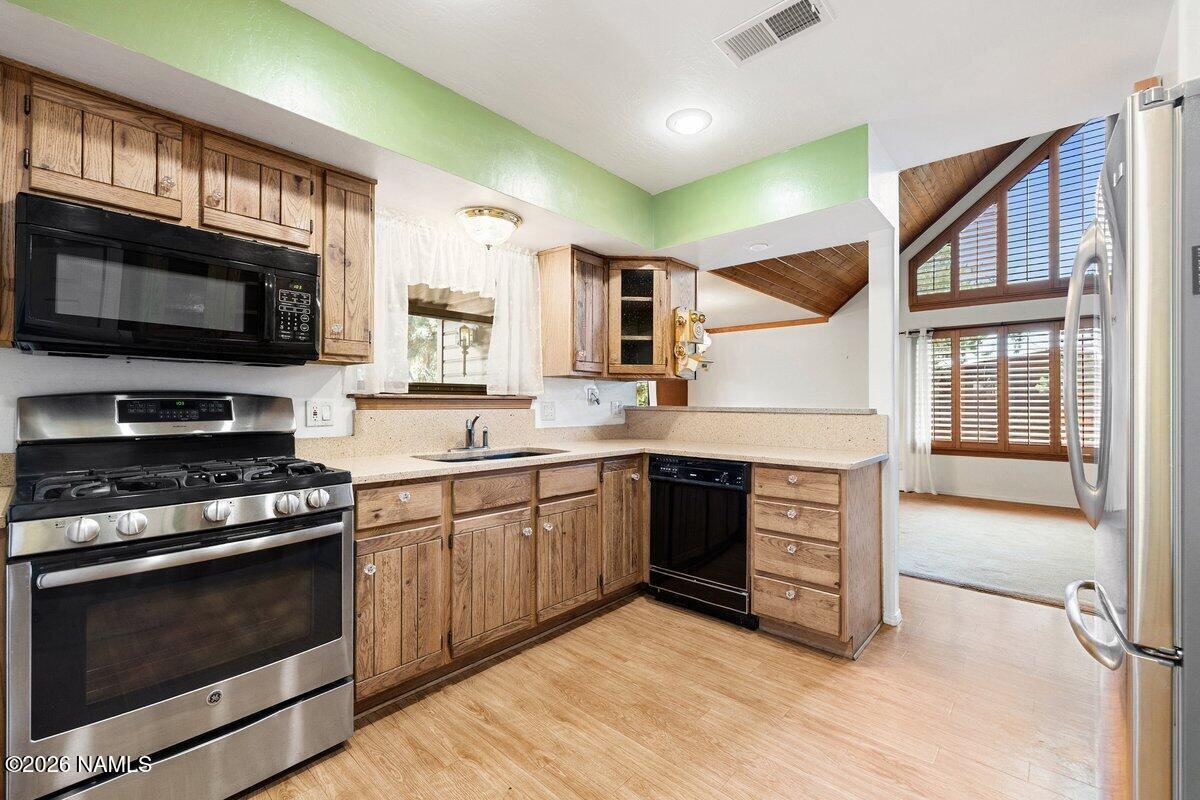 5535 East Western Star Road Flagstaff, AZ 86004 - Photo 11 of 49 a kitchen with a stove and a microwave