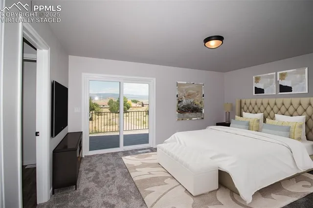 a bedroom with a balcony a bed and a flat screen tv