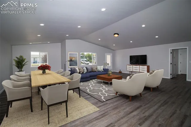 a view of kitchen with refrigerator and window