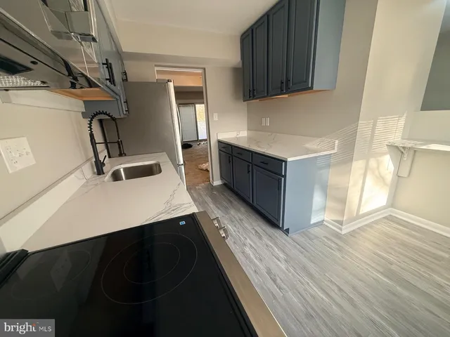 a kitchen with a sink and cabinets