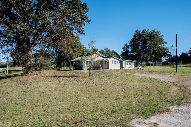 a house with trees in front of it