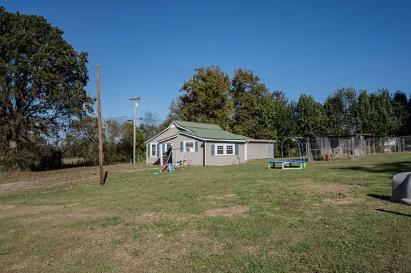 a house with trees in the background