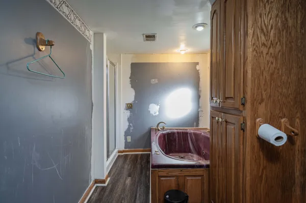 a view of hallway with wooden floor
