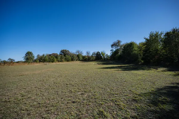 a view of lake with green space