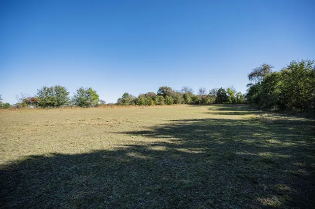 a view of a lake with a big yard