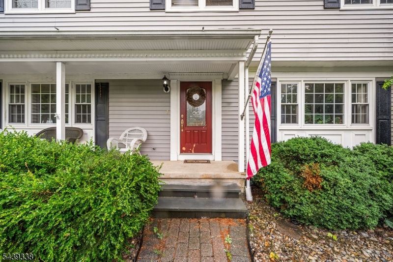 1 Oak Grove Road Flemington, NJ 08822 - Photo 3 of 29 a front view of a house with potted plants
