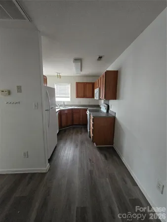 a view of empty room with ceiling fan